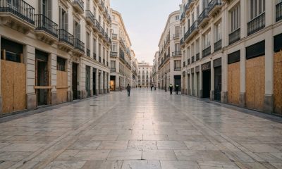 Boarded-up shop fronts in a pedestrian shopping street in Málaga