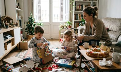 A family with children opening presents on Three Kings Day morning in a Spanish home